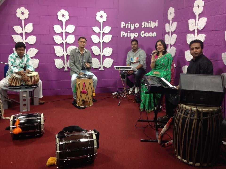 Rowshanara Moni singing in the Priyo Shilpi Priyo Gaan studio with tabla and dhol players